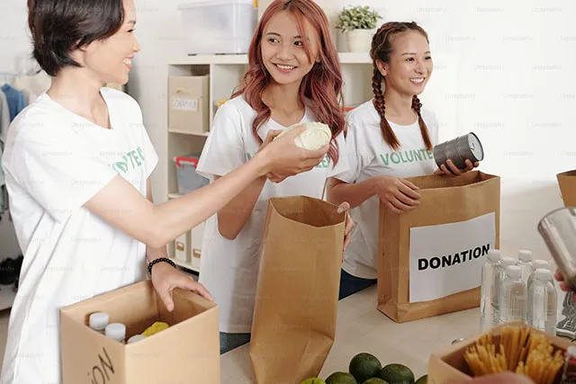 Volunteers packing donation bags for a community program